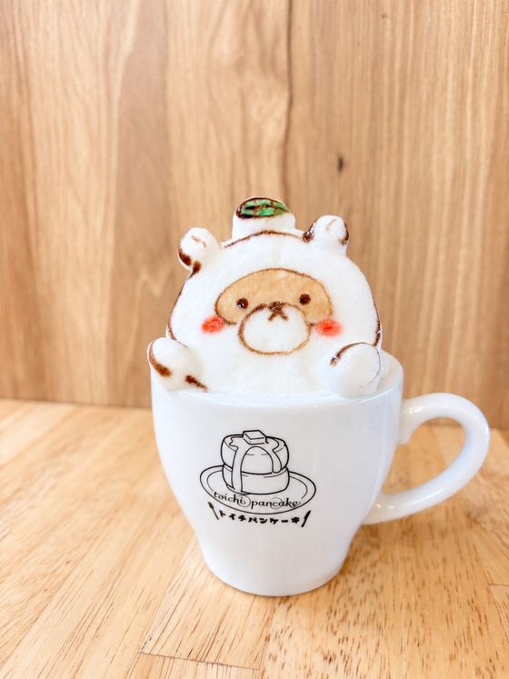 3D latte art of a bear in a hood
